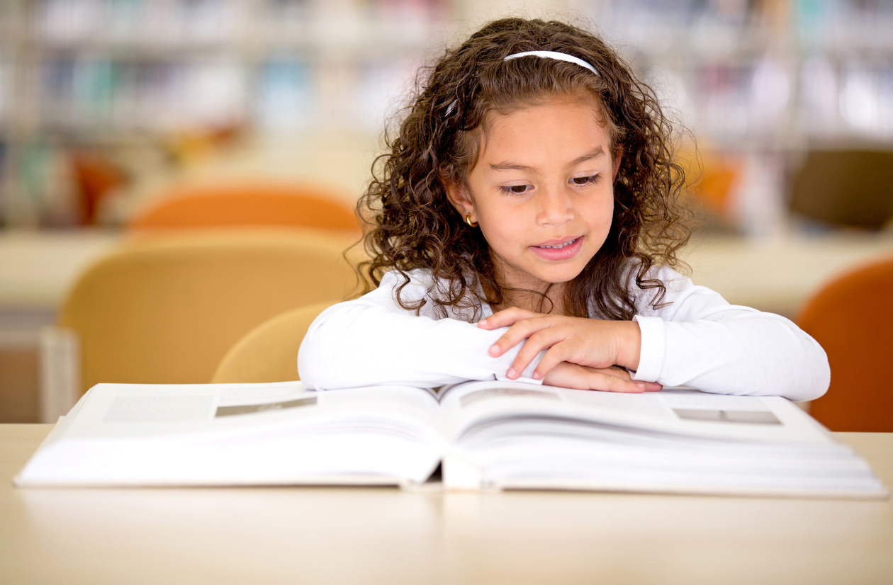 School Girl Reading a Book