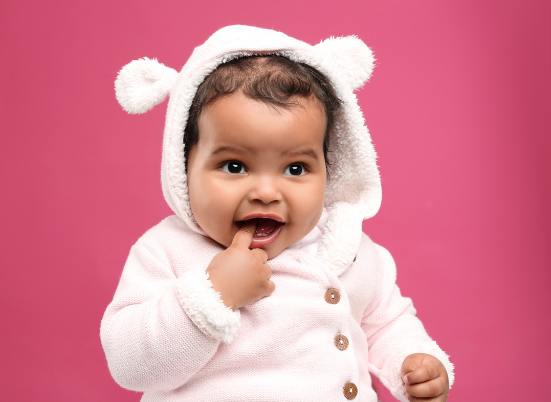 Cute African American Baby on Pink Background
